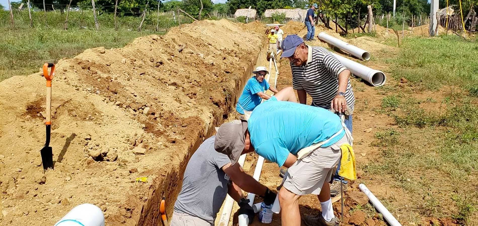 The trenching for the piping is dug side by side with the local residents.