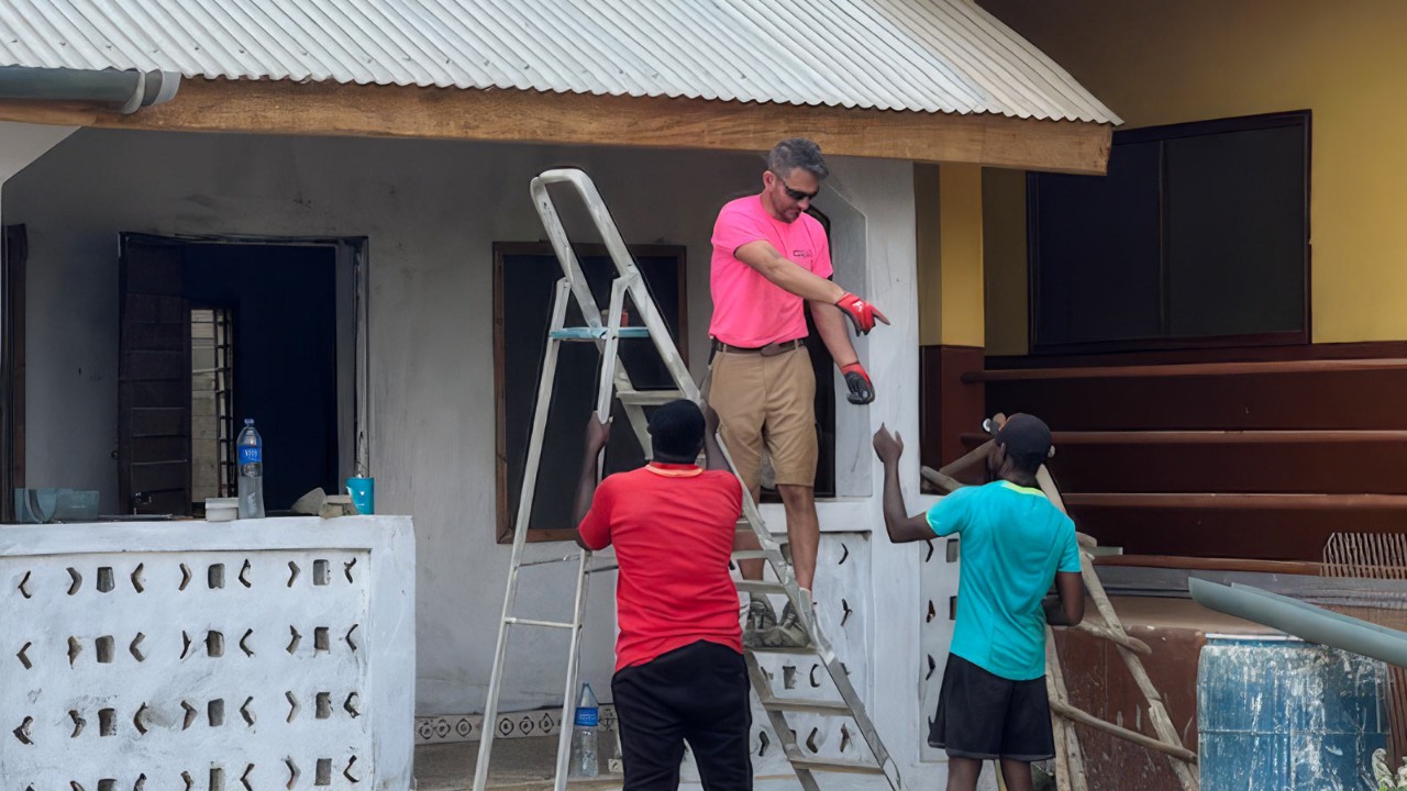 Matt and the guys putting up roof gutters